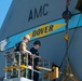 Enlisted personel repairing rudder