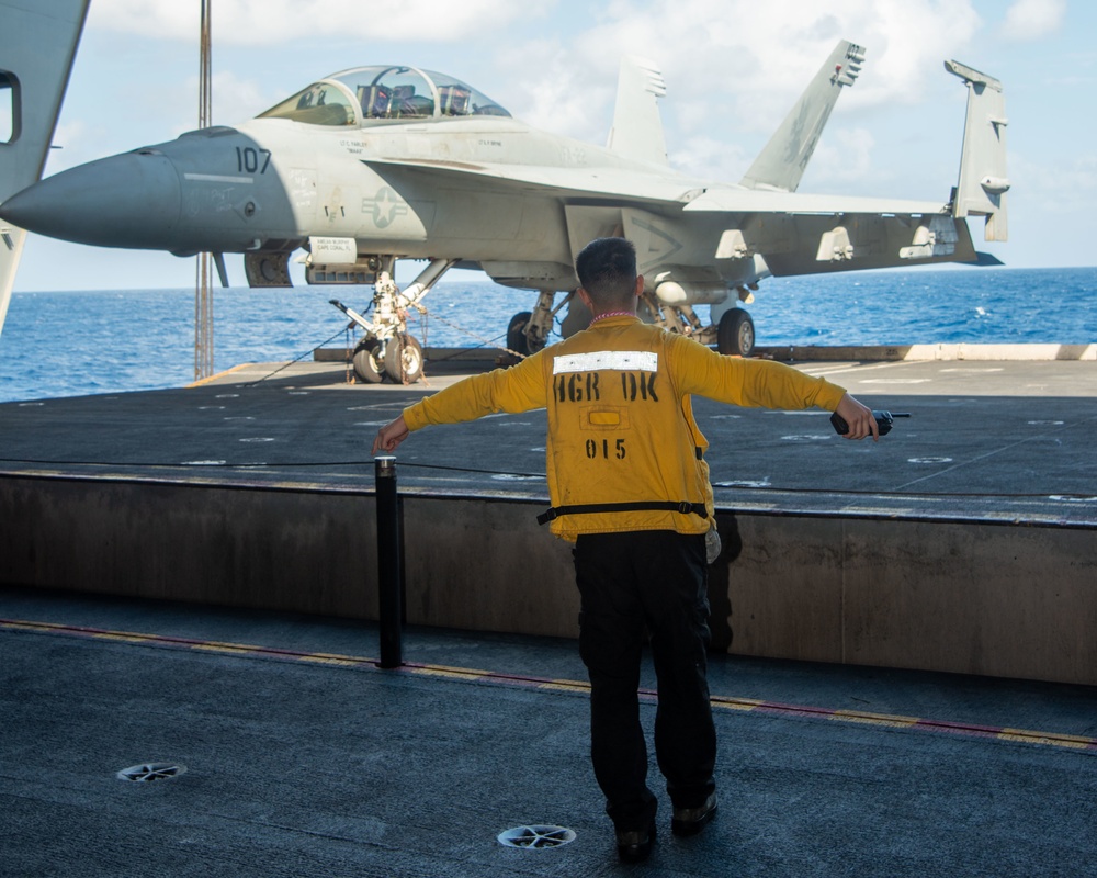 Sailor Directs Aircraft Elevator