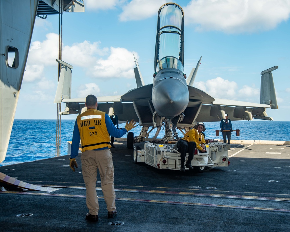 Sailor Directs Aircraft Towing