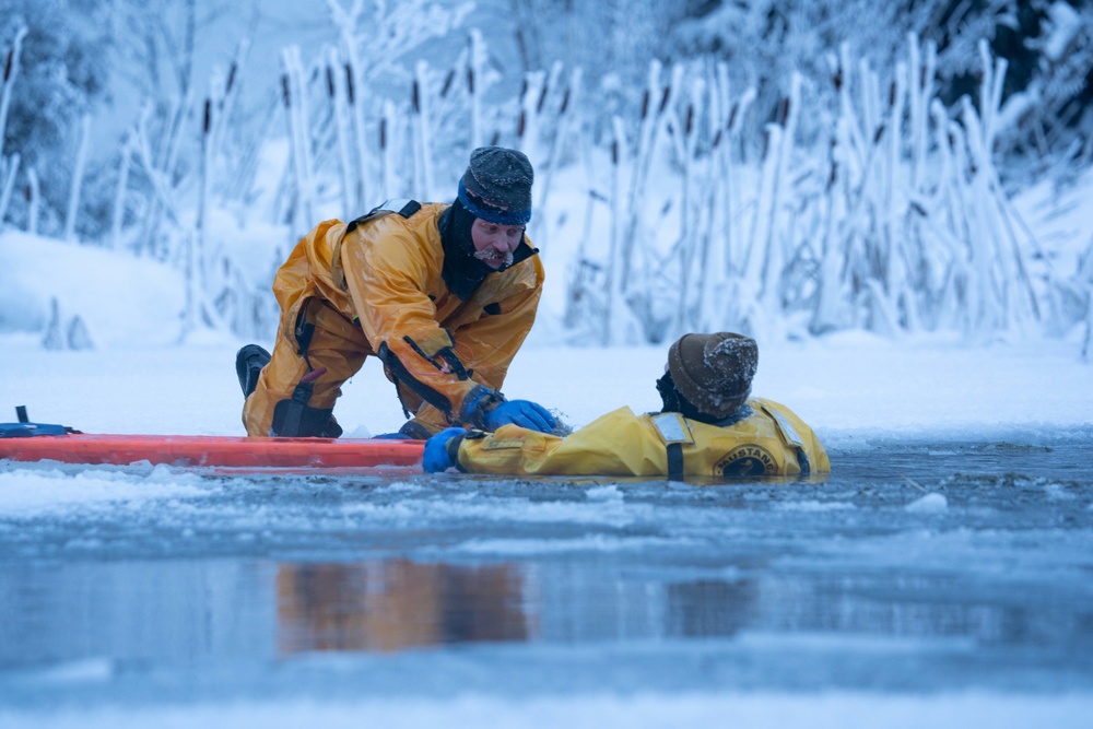 JBER Firefighters conduct Ice Water Rescue Training