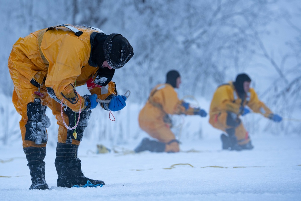 JBER Firefighters conduct Ice Water Rescue Training