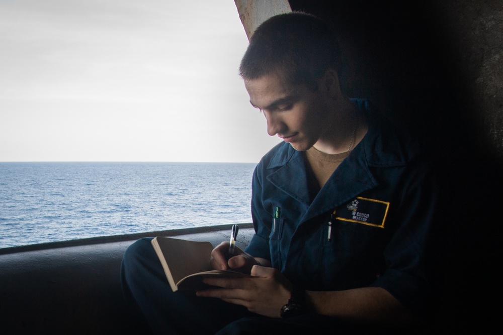 U.S. Navy Sailor Writes Journal Entry