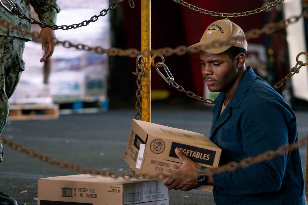 USS Carl Vinson (CVN-70) Sailor Participates In Stores Onload