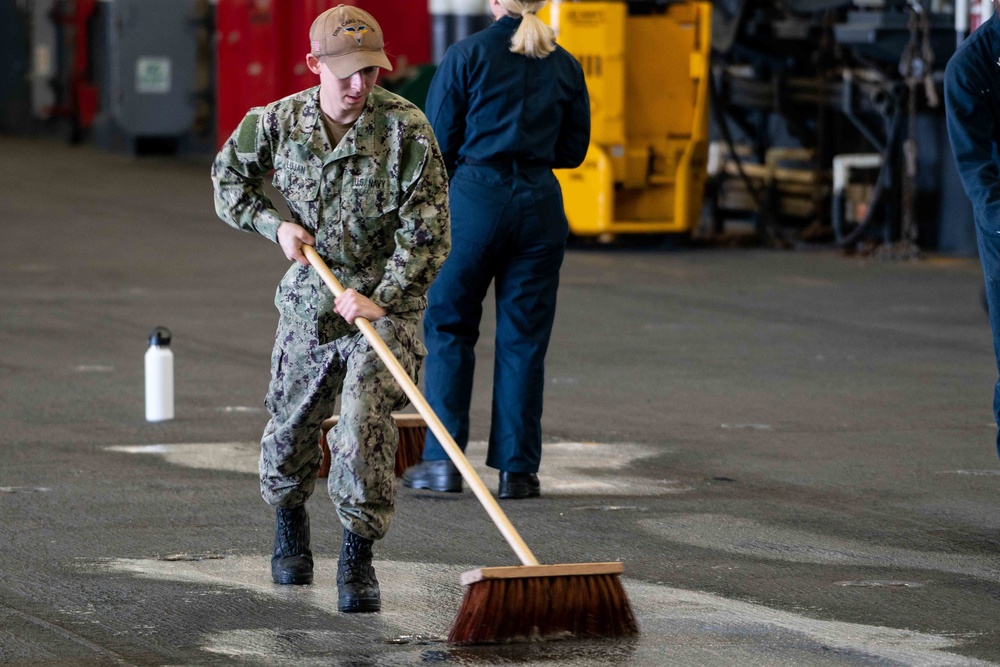 USS Carl Vinson (CVN-70) Sailor Cleans Hanger Bay