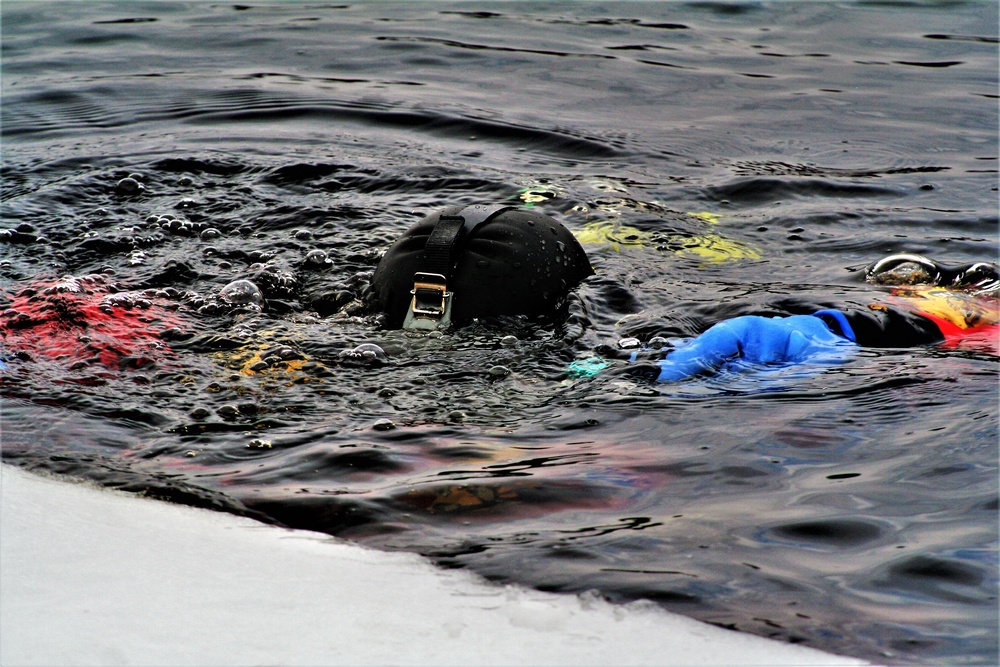 Firefighters on installation fire department dive team participate in ice rescue training at frozen lake at Fort McCoy