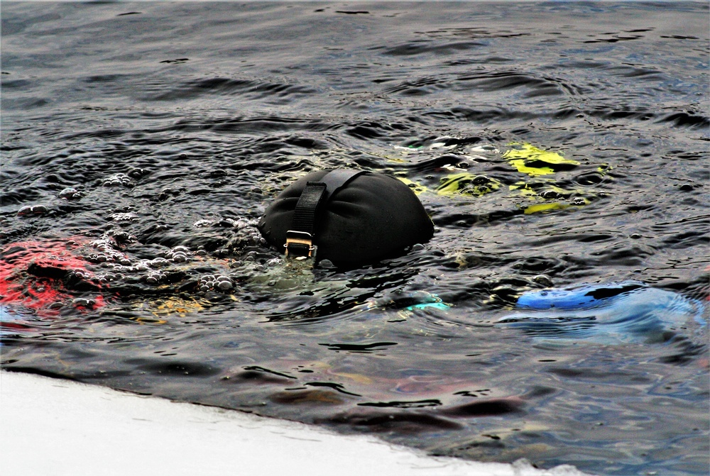 Firefighters on installation fire department dive team participate in ice rescue training at frozen lake at Fort McCoy