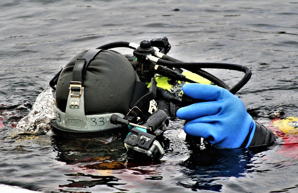 Firefighters on installation fire department dive team participate in ice rescue training at frozen lake at Fort McCoy