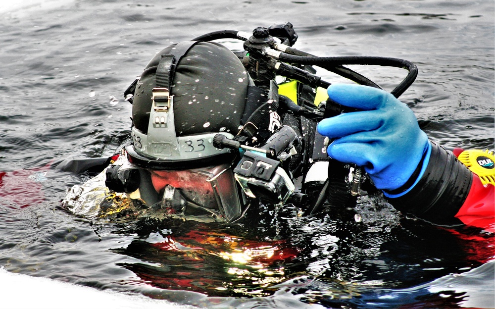 Firefighters on installation fire department dive team participate in ice rescue training at frozen lake at Fort McCoy