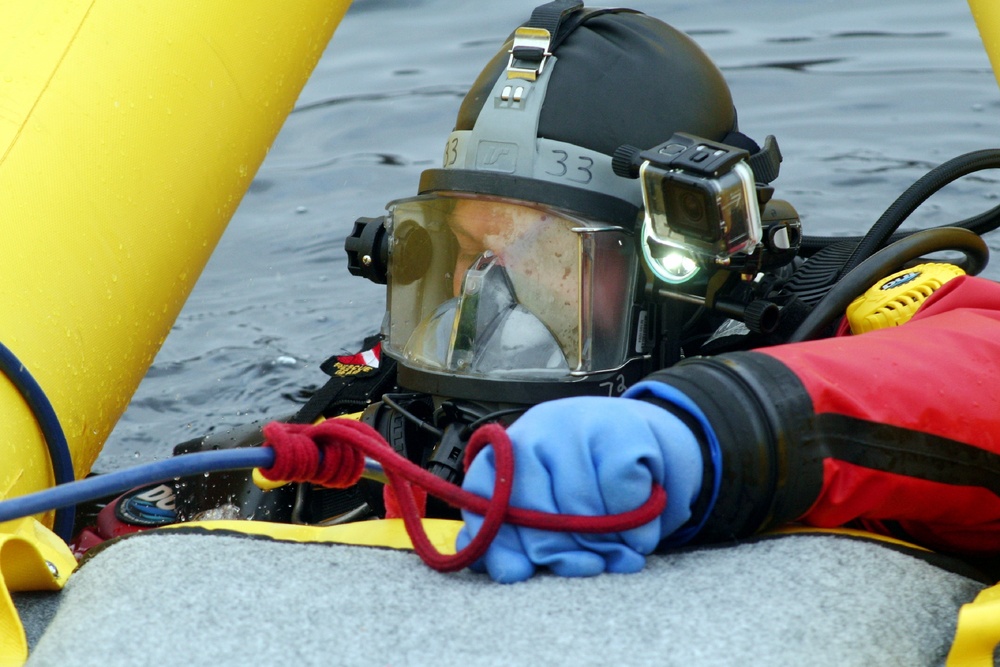 Fort McCoy firefighters hold ice rescue diving training at frozen-over installation lake