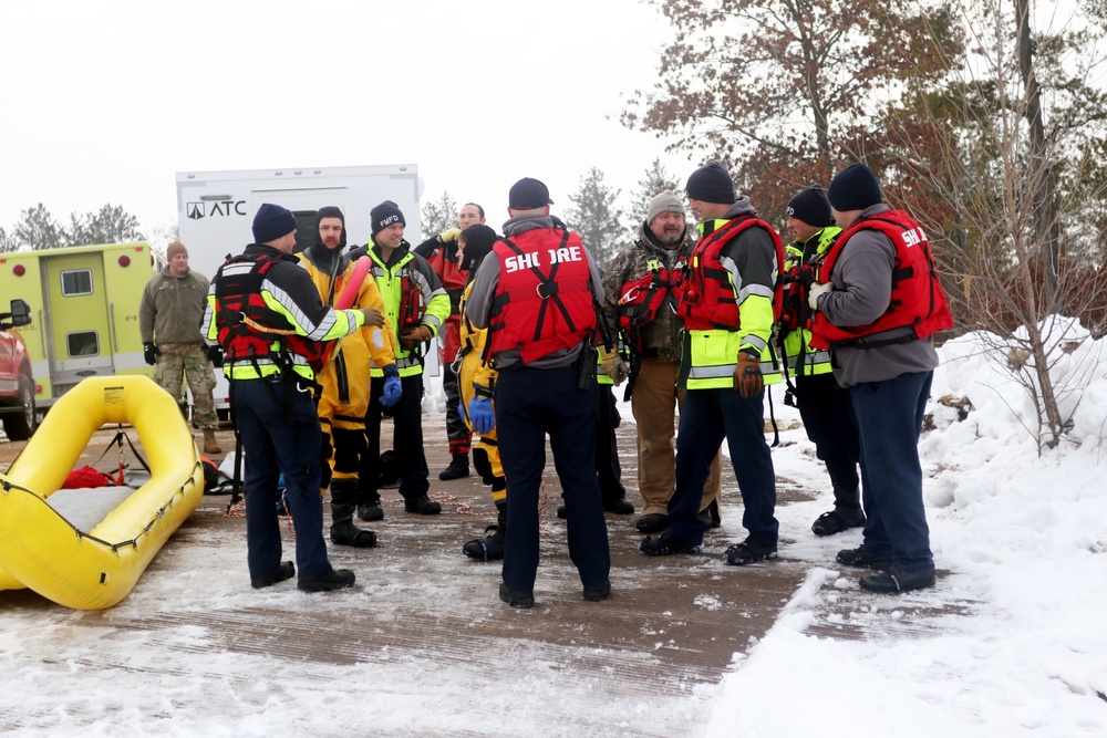 Fort McCoy firefighters hold ice rescue diving training at frozen-over installation lake