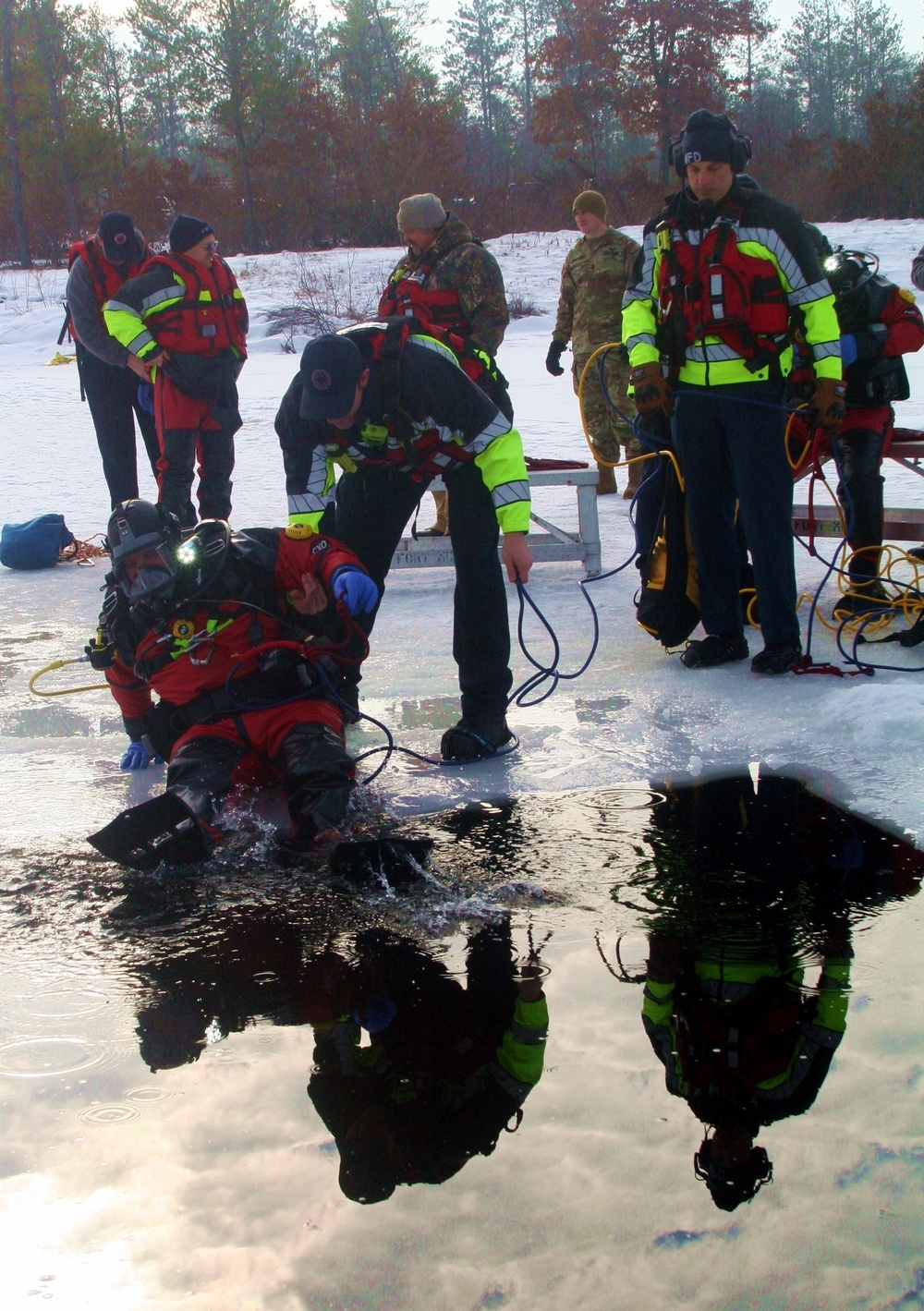 Fort McCoy Fire Department dive team conducts ice rescue training at frozen lake at Fort McCoy