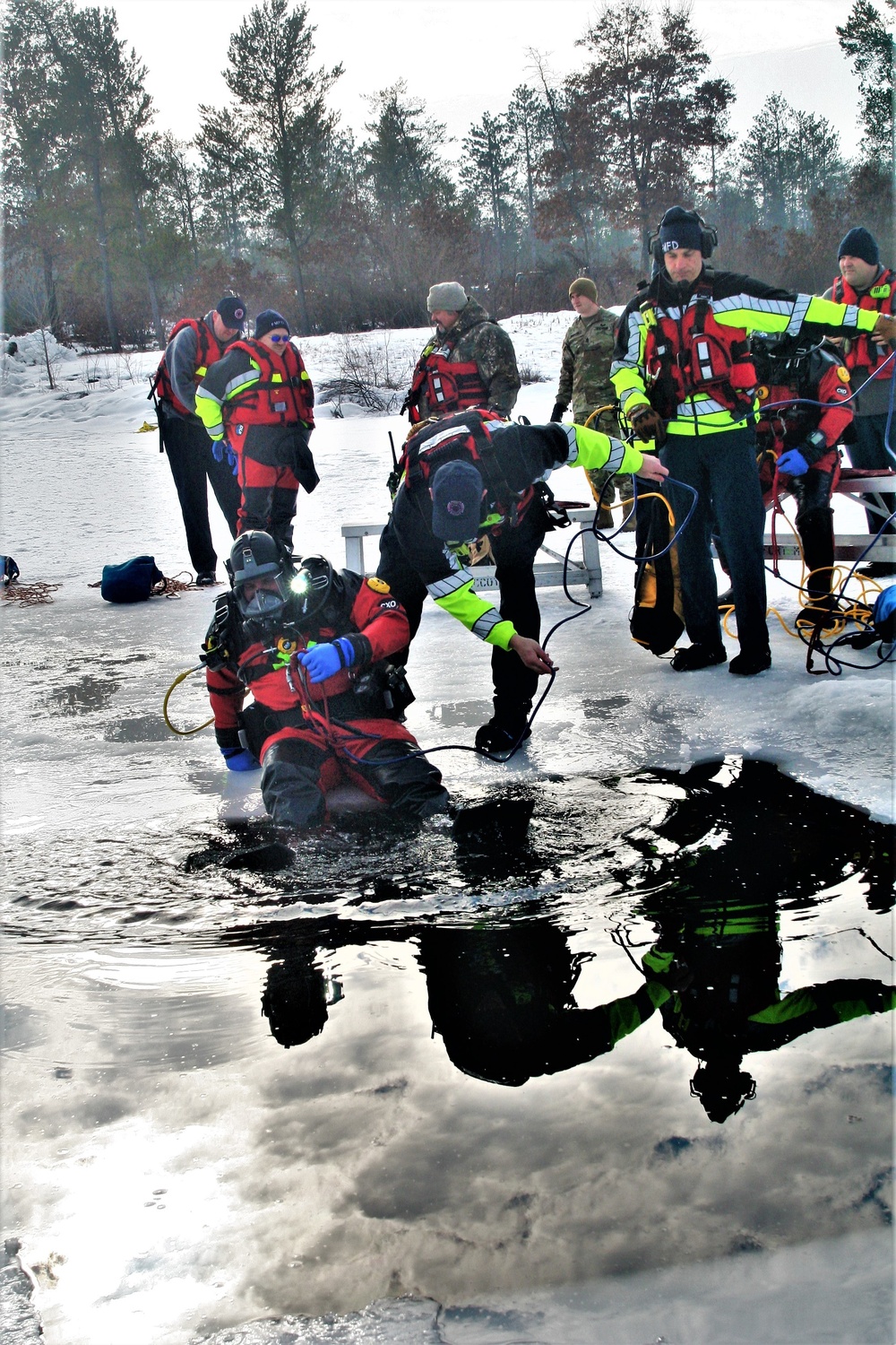 Fort McCoy Fire Department dive team conducts ice rescue training at frozen lake at Fort McCoy