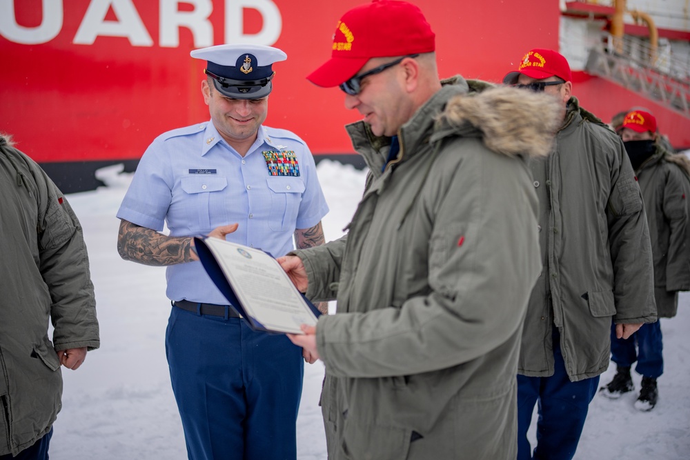 Coast Guard Cutter Polar Star (WAGB 10) conducts an advancement ceremony on the ice in Antarctica