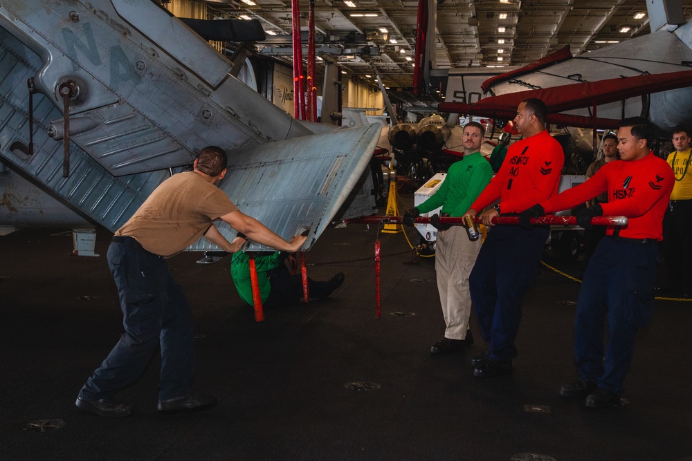 U.S. Sailors Fold Helicopter Tail