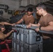 Sailors Perform Maintenance on Outboard Tension Plate