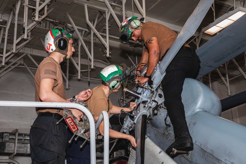 Sailors Perform Maintenance on Outboard Tension Plate