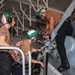 Sailors Perform Maintenance on Outboard Tension Plate