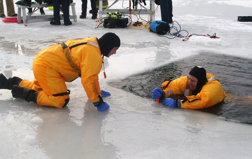 Fort McCoy firefighters train to save people clinging to ice with surface ice rescue training