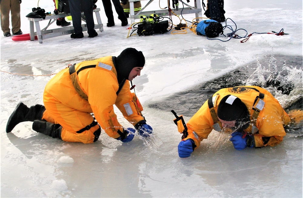 Fort McCoy firefighters train to save people clinging to ice with surface ice rescue training