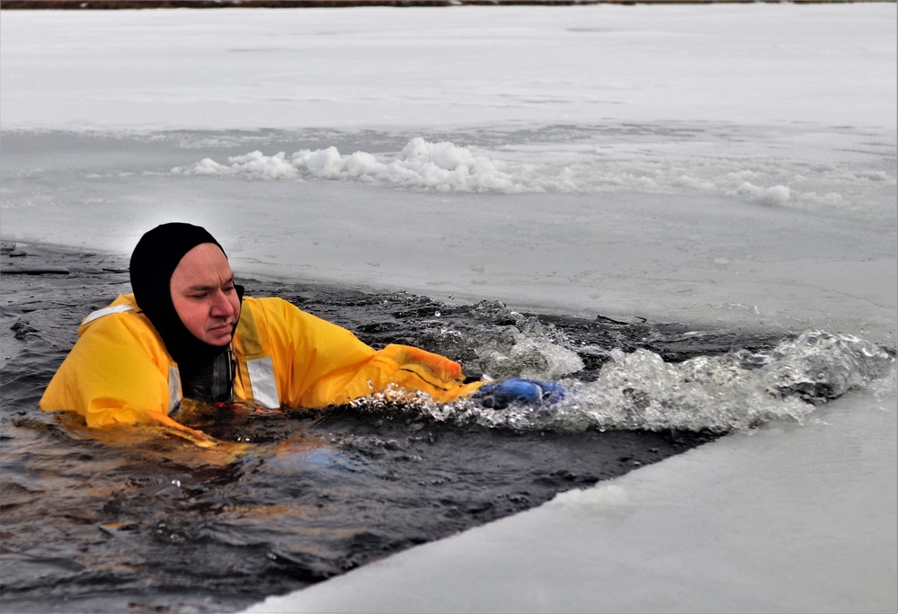 Fort McCoy firefighters train to save people clinging to ice with surface ice rescue training