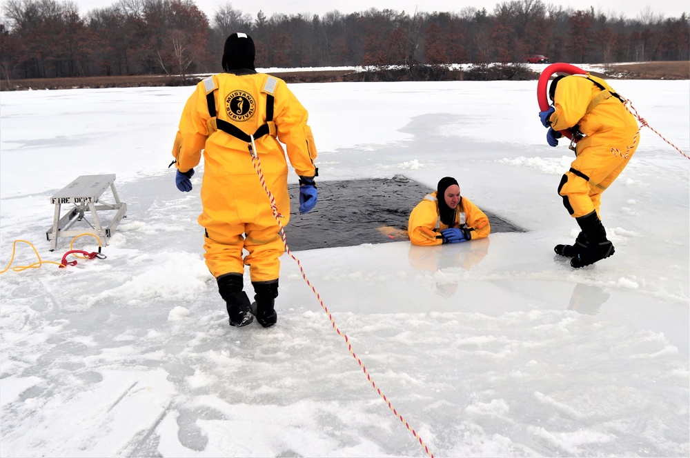 Fort McCoy firefighters train to save people clinging to ice with surface ice rescue training