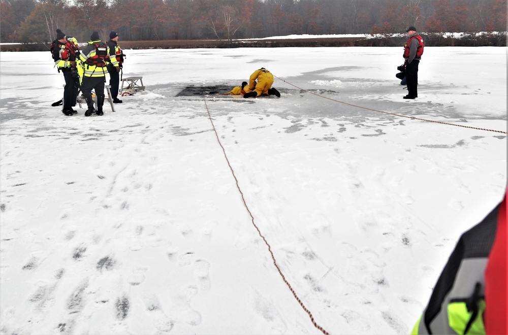 Fort McCoy firefighters train to save people clinging to ice with surface ice rescue training