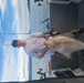 CS1 Zach Hassilev fishing for local Alaskan Halibut