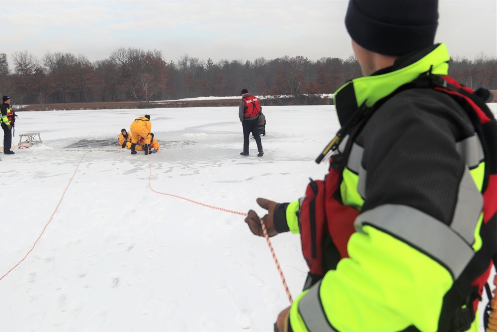 Fort McCoy firefighters train to save people clinging to ice with surface ice rescue training