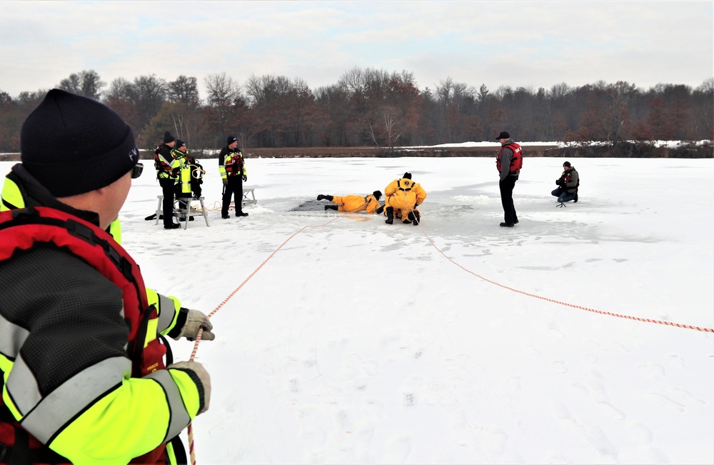 Fort McCoy firefighters train to save people clinging to ice with surface ice rescue training