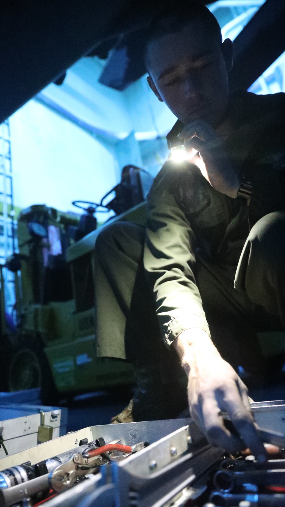 U.S. Marines Conduct Aircraft Maintenance Aboard USS John. P. Murtha