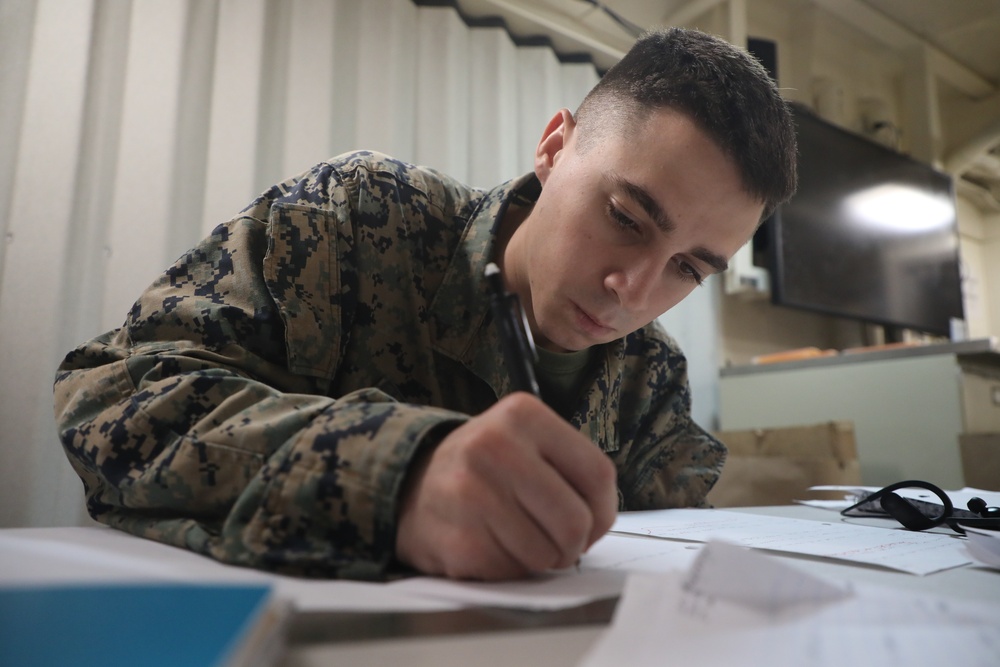 U.S. Marines Study for College Aboard USS John P. Murtha