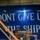 USS Ronald Reagan (CVN 76) Sailors hang banner in the hangar bay