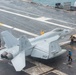 Sailor Tow An F/A-18E Super Hornet On The Flight Deck