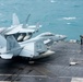 Sailor Directs An F/A-18F Super Hornet On The Flight Deck