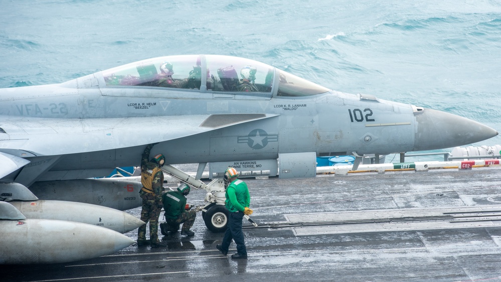 Sailors Secure An F/A-18F Super Hornet To Catapult