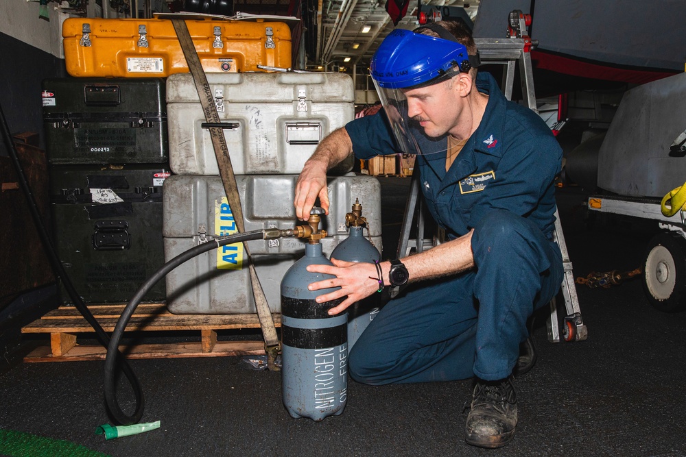 Sailor Fills Nitrogen Cylinders