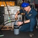 Sailor Fills Nitrogen Cylinders