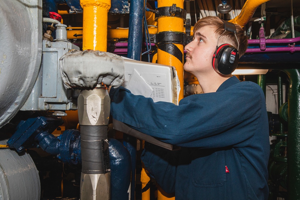 U.S. Sailor Inspects Pipe Readout