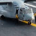 U.S. Navy Sailors Chain Down An Osprey