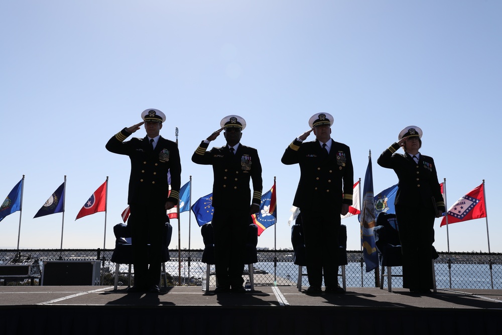 Sailors render salute during National Anthem