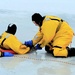 Fort McCoy firefighters train to save people clinging to ice with surface ice rescue training