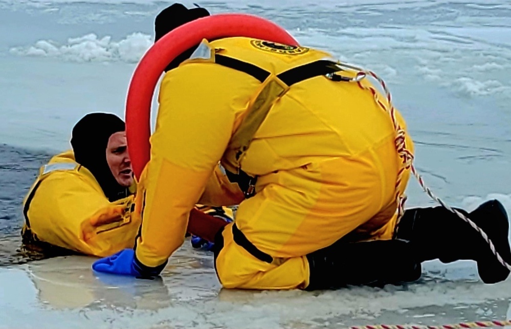 Fort McCoy firefighters train to save people clinging to ice with surface ice rescue training