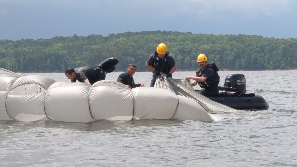 Soldiers from the 95th Civil Affairs Brigade (SO)(A) conduct a water jump at Mott Lake