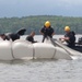 Soldiers from the 95th Civil Affairs Brigade (SO)(A) conduct a water jump at Mott Lake