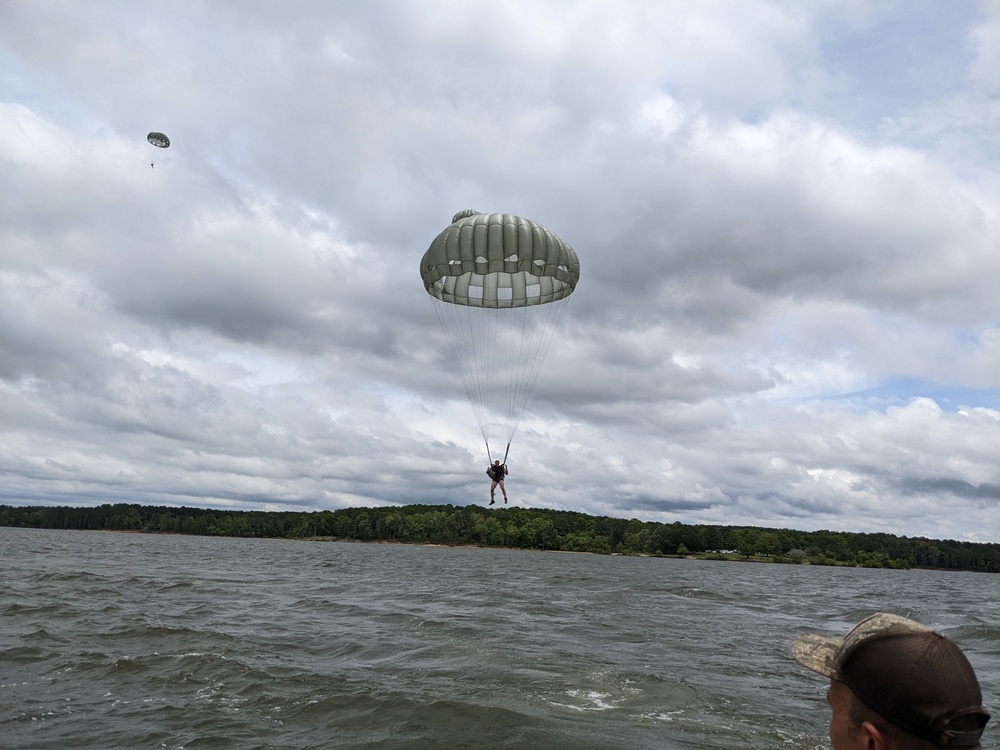 Soldiers from the 95th Civil Affairs Brigade (SO)(A) conduct a water jump at Mott Lake