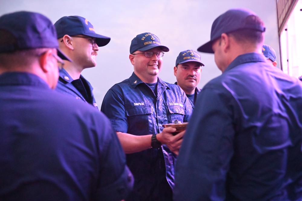 USCGC Spencer's crew gathers for a Cutterman ceremony