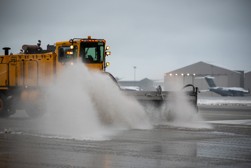 Base snow-removal team clears flightline