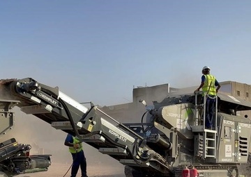 Workers Operate a USAID-Provided Jaw Crusher in Abuselim, Libya