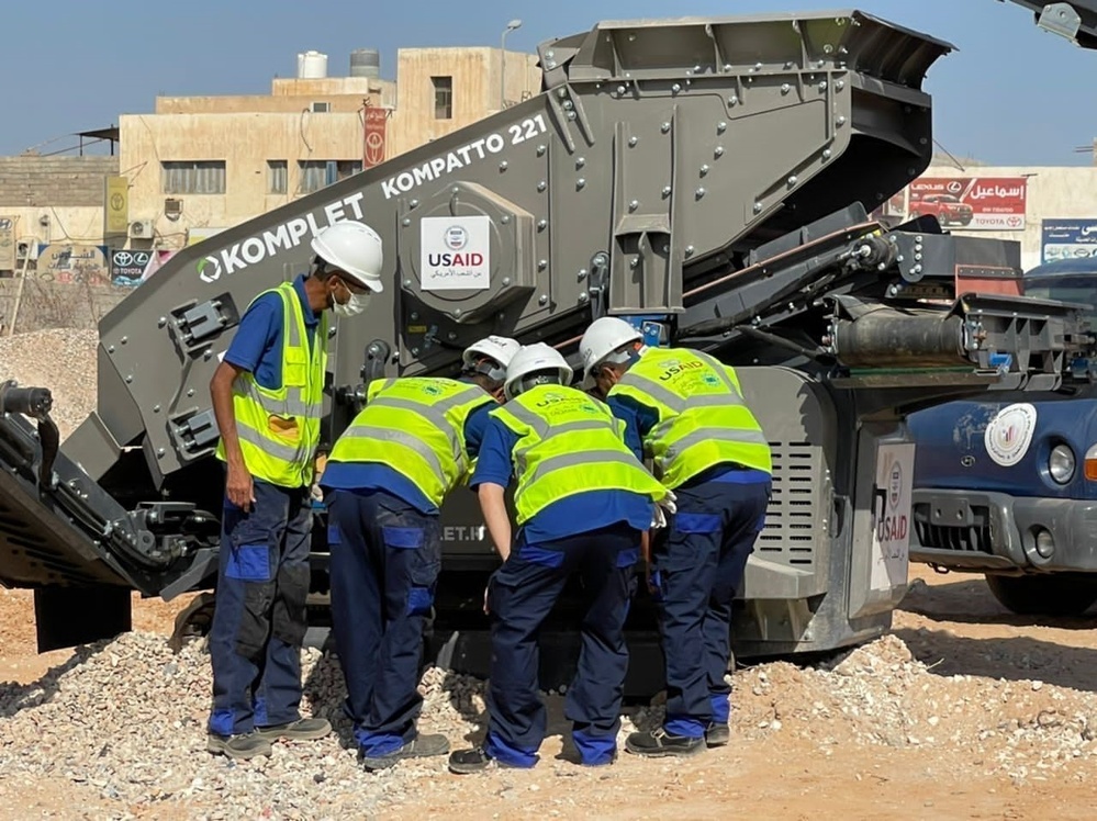 Construction Staff Inspect the Jaw Crusher that USAID Provided to Abuselim, Libya