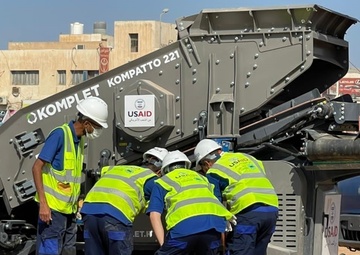 Construction Staff Inspect the Jaw Crusher that USAID Provided to Abuselim, Libya